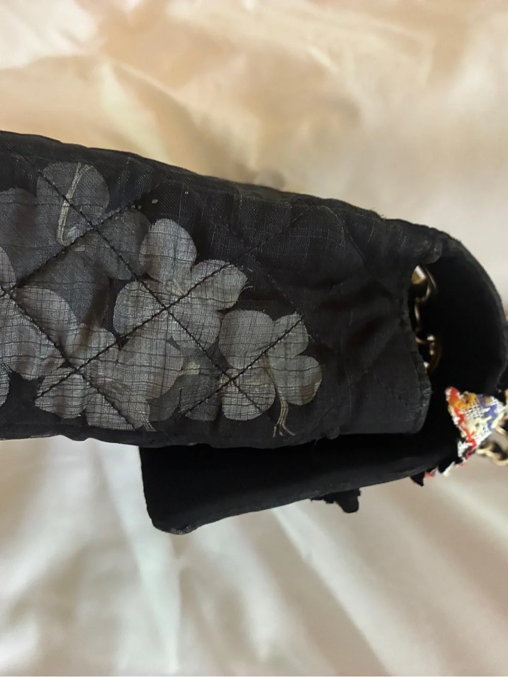 CHANEL Black Quilted Shoulder Bag with Red Floral Appliqués